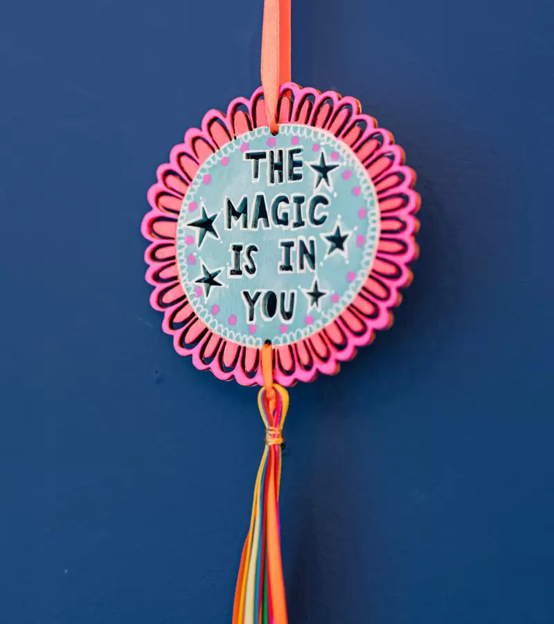 Hand painted decoration, by Amy Swann saying the magic is in you