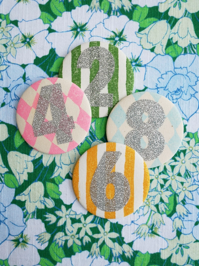 Silver glitter badges in various numbers