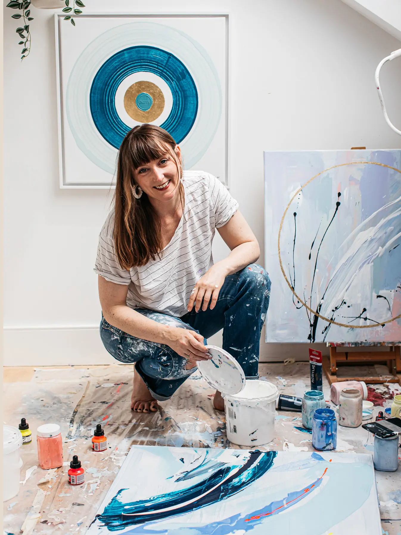 Artist Kate Mayer working in her studio