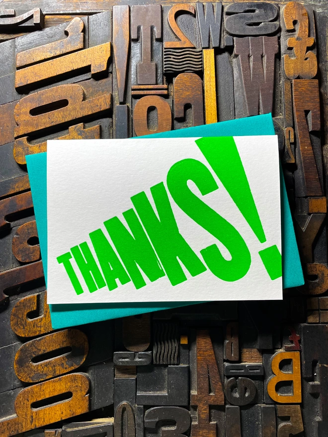 Thanks! A vibrant thank you typographic letterpress card with deep impression print using fluorescent green, with a range of colourful envelopes. Slight print variations adding to the style anding to the charm of this handmade greeting card.