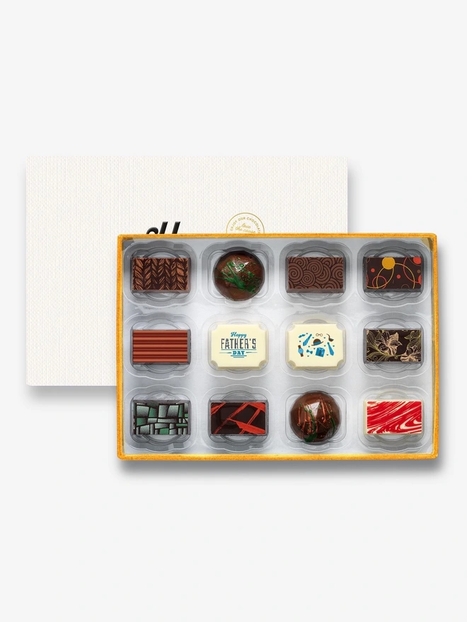 A box of 12 chocolates with two Father's Day message chocolates