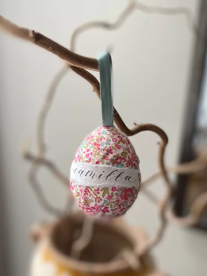 Personalised Liberty fabric decorative egg hanging on a branch