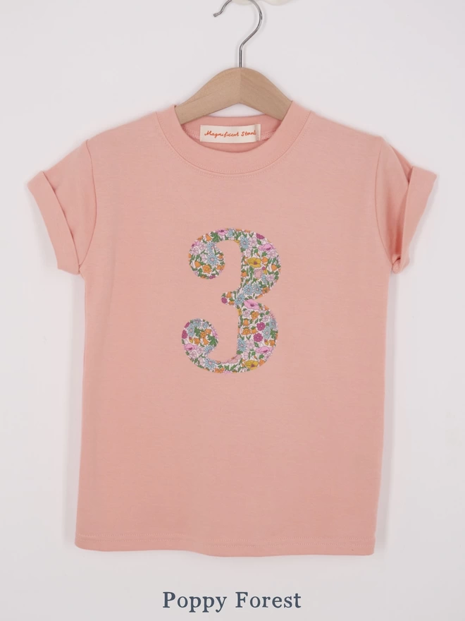 a pink t-shirt appliquéd with a number 3 in floral Liberty print