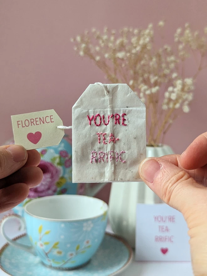 Embroidered You're tea-rrific and tag held 