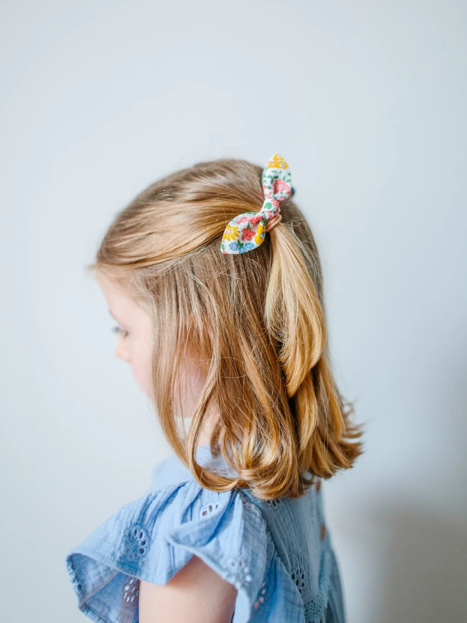 Girl with a pretty liberty hair bobbles 