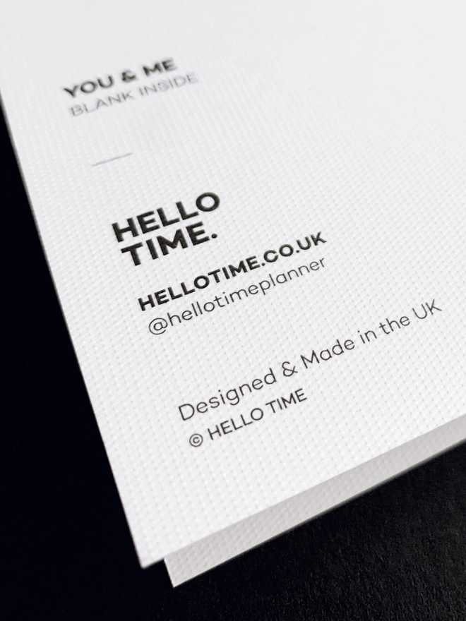 Close up of the dot texture of a HELLO TIME greetings card.