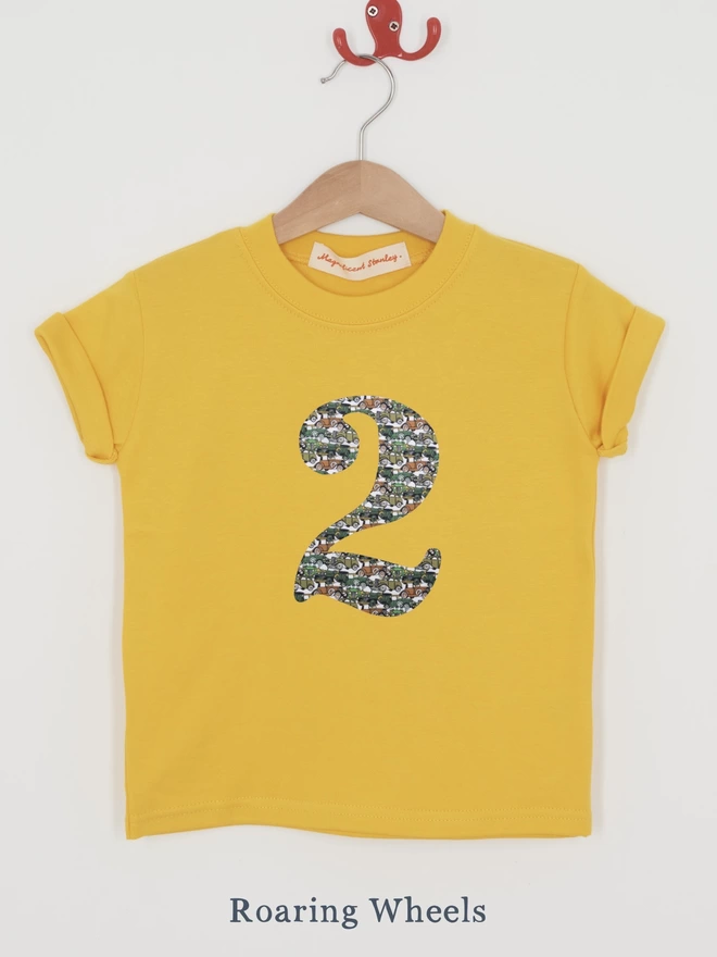a yellow t-shirt with a vintage car Liberty print number 2 on front
