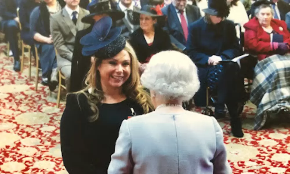 Holly receiving her MBE
