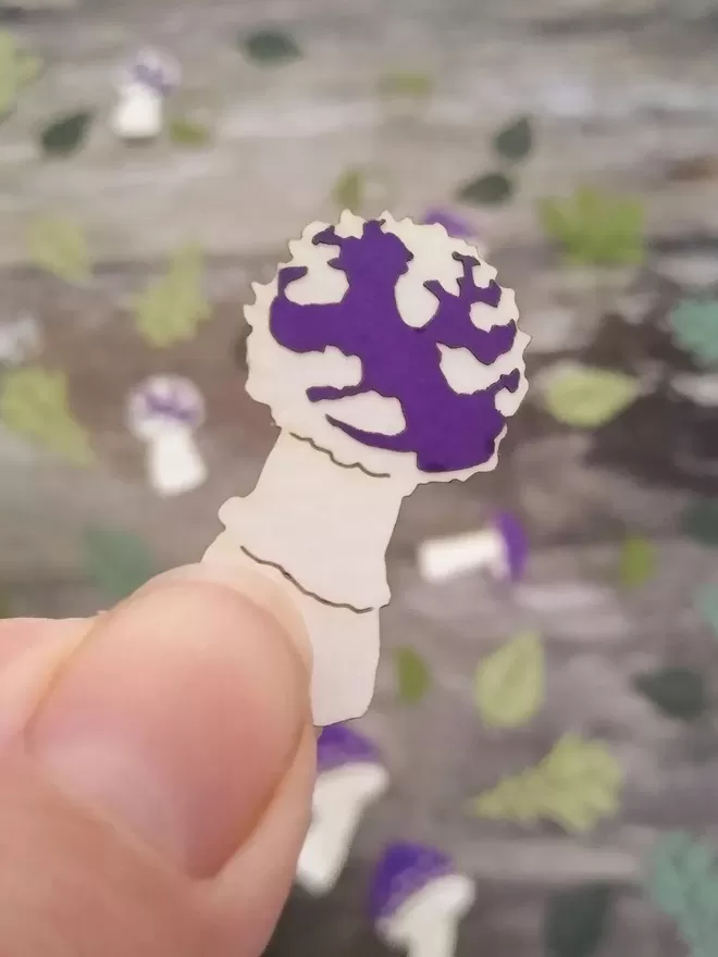 Closeup of purple and white puffball toadstool confetti piece