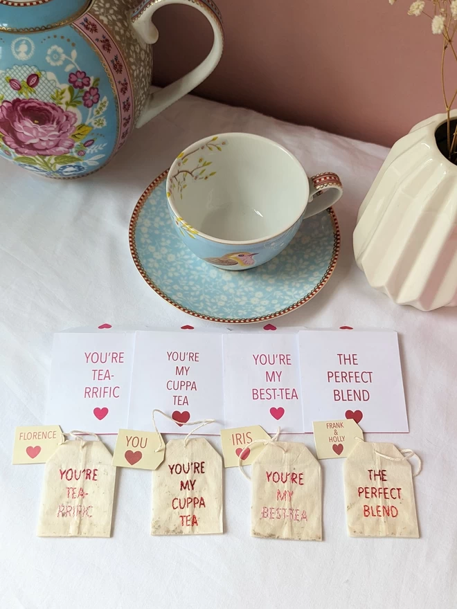 Range of embroidered teabags shown together 