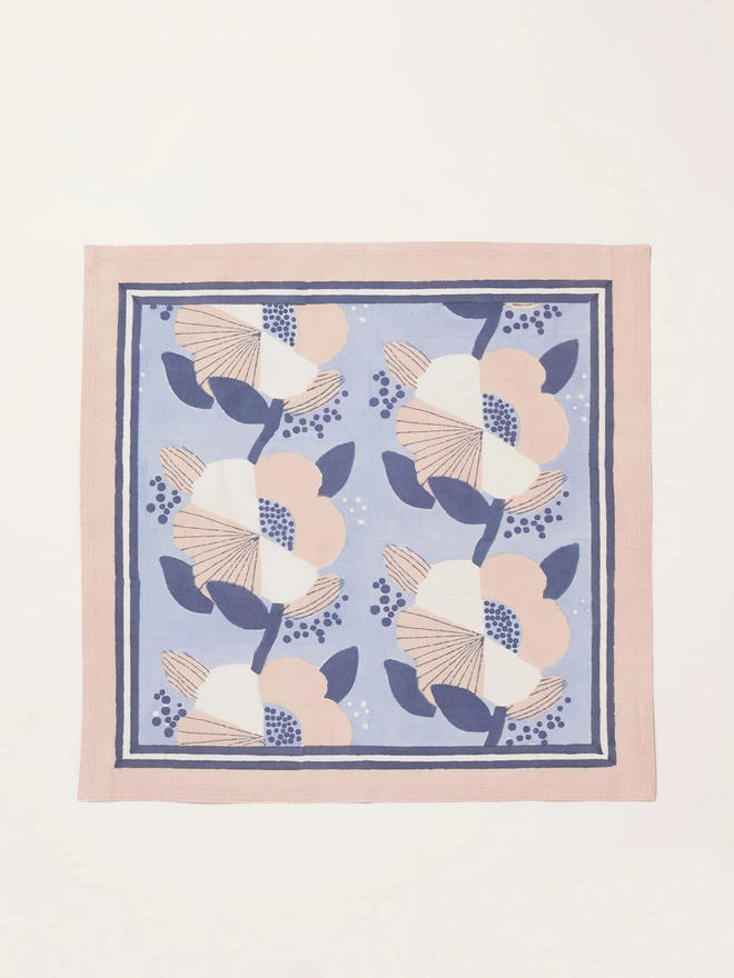 Single block printed large scale floral napkin in shades of cream, pale blue and dusty pink