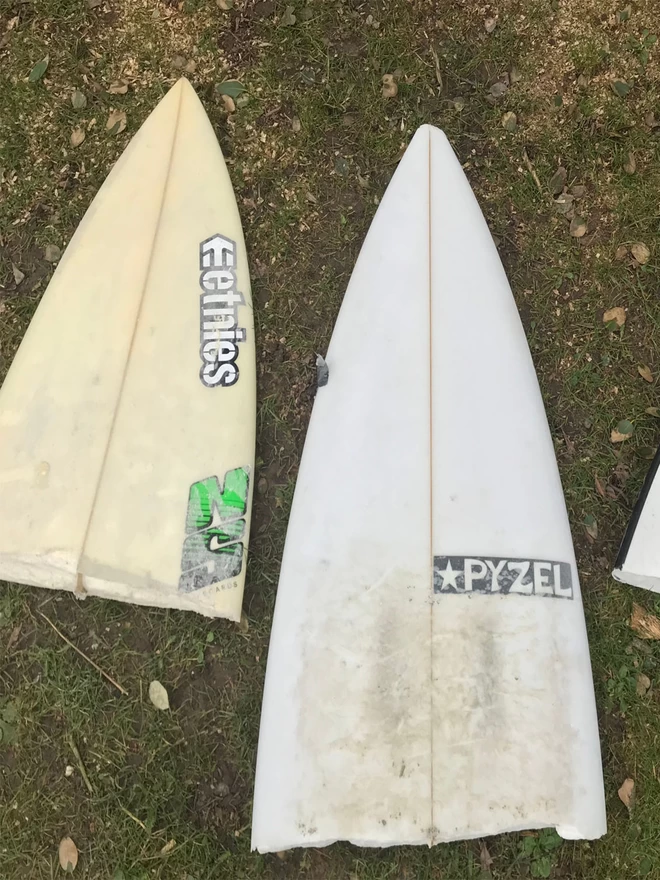 broken noses of old, dis-used surfboards