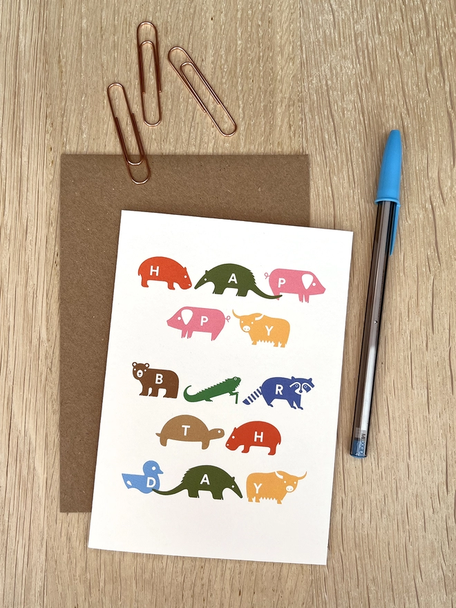 Birthday card with a variety of brightly coloured animals