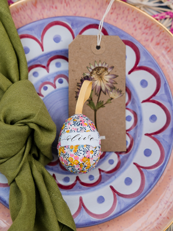Personalised Liberty fabric decorative egg on a patterned plate