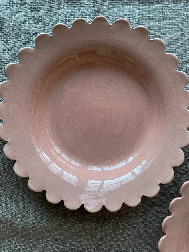 rose gold shallow bowl with scalloped edge