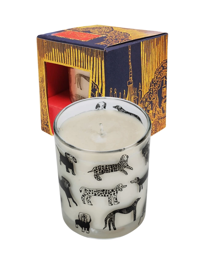 dogalicious rhubarb & ginger candle in a Reusable glass with black dog illustrations next to box 