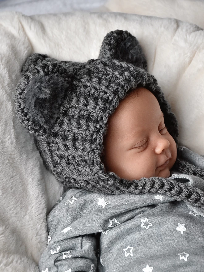 Baby sleeping wearing handmade hat