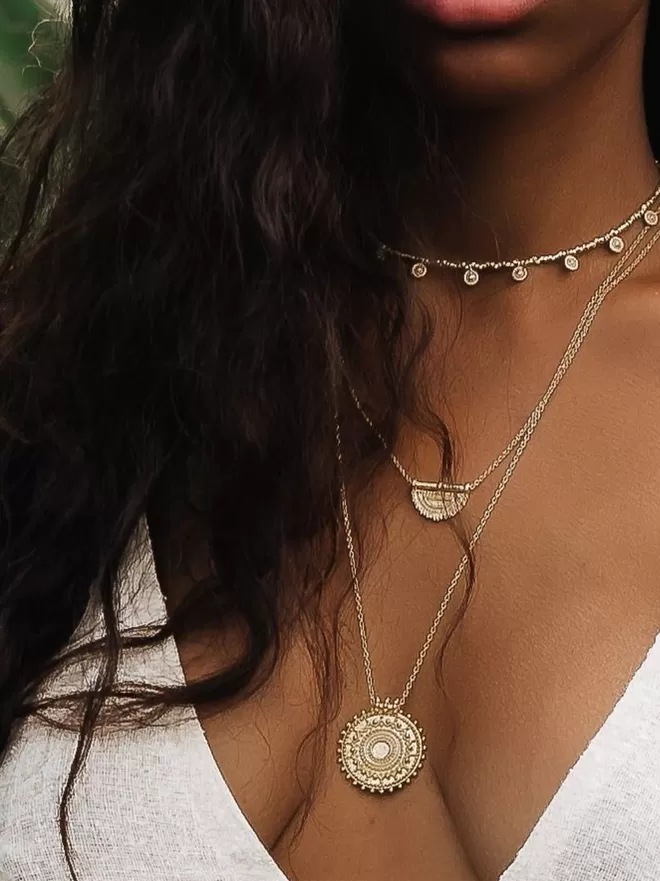 Long gold coin pendant with layering necklaces