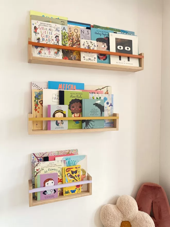 Small, Medium & Large Autumn's Corner wooden Boookshelves. Full of beautiful Kids books with beautiful coloured bars.