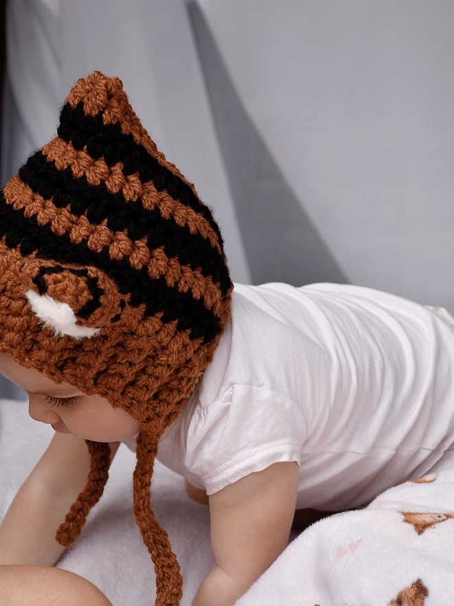 Baby wearing tiger hat