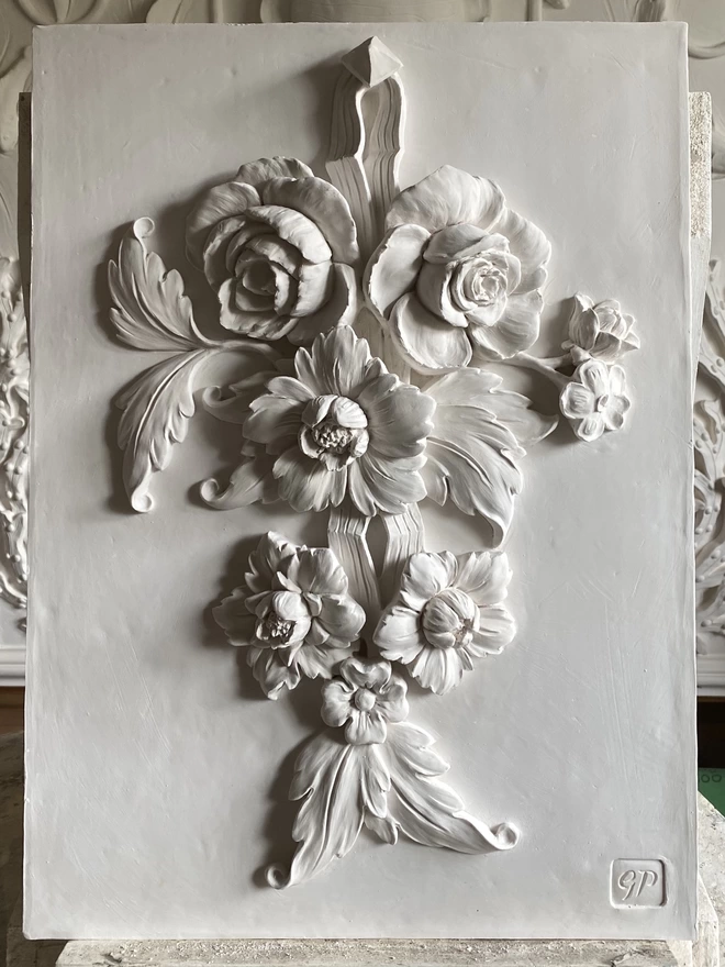 Flower Drop I white plaster wall sculpture with flower design 