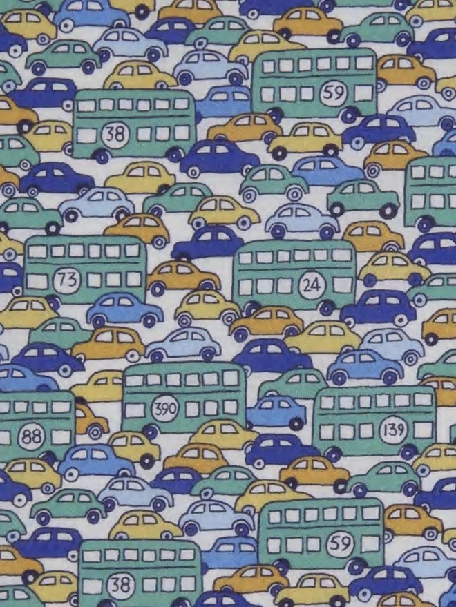 Liberty print cotton Hop on Hop Off featuring vintage busses and cars in green blue and yellow