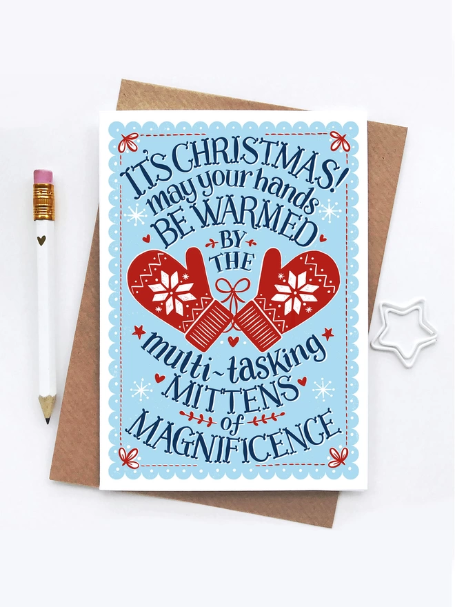 blue and red christmas mittens card with envelope white pencil and white star clip