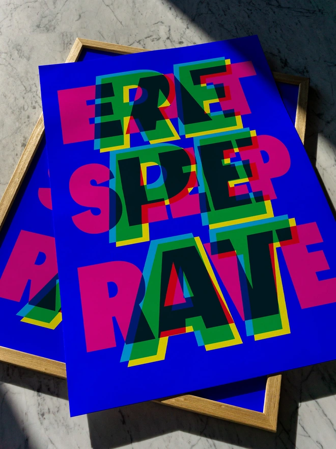 A colourful giclée typographic print with the words "Eat Sleep Rave Repeat" in bright pink, green, blue, and yellow, laid on a wooden frame against a marble surface. An ideal gift for an old raver!