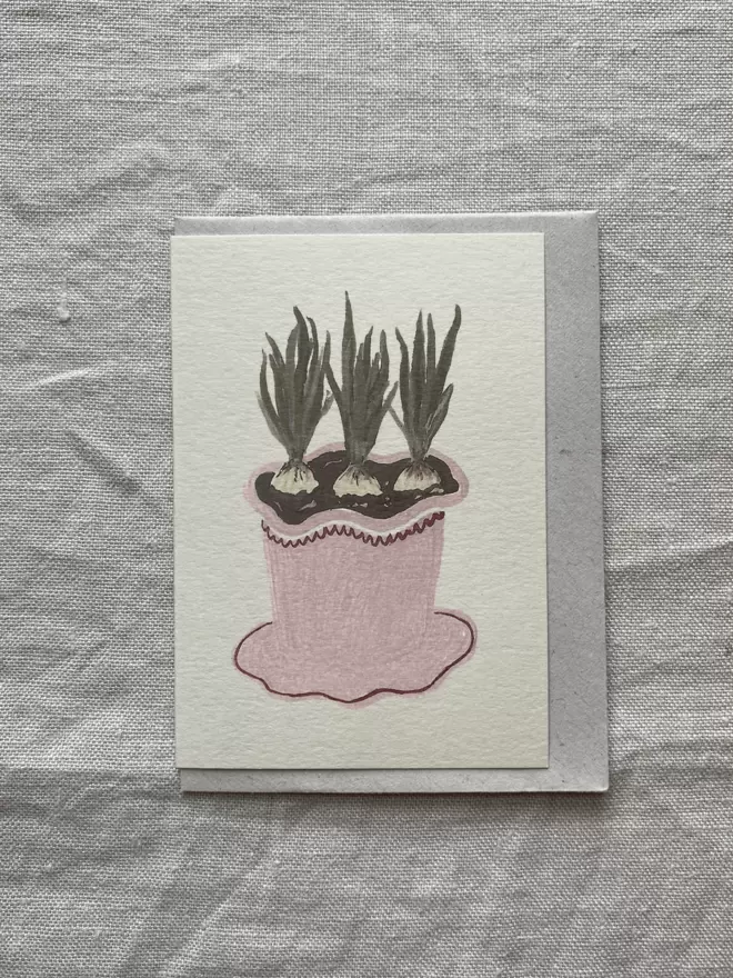card with bulbs growing with pink frilly pot. 