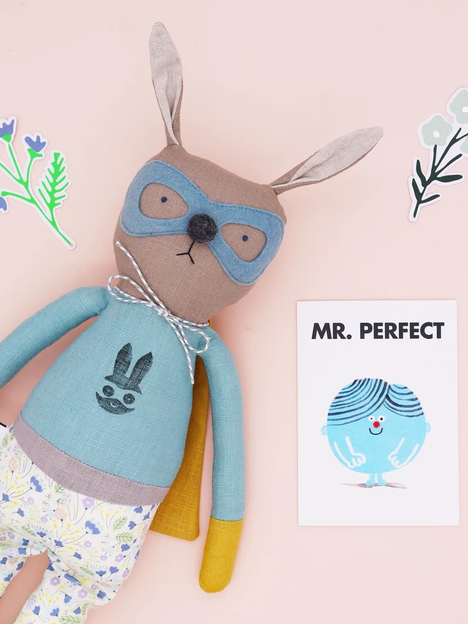 fabric bunny rabbit doll in light blue with superhero outfit