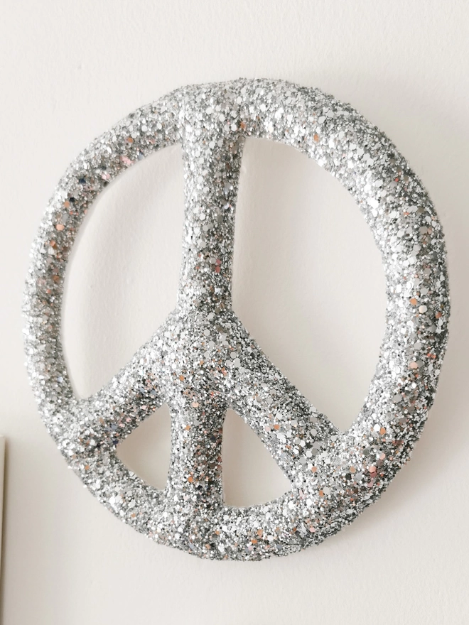 Close up detail of silver peace sign