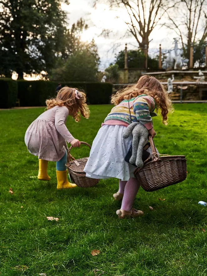 Child carrying a personalised easter bunny wicker basket