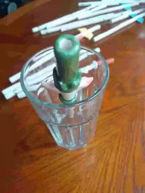 Ceramic Elf Straw in a glass back