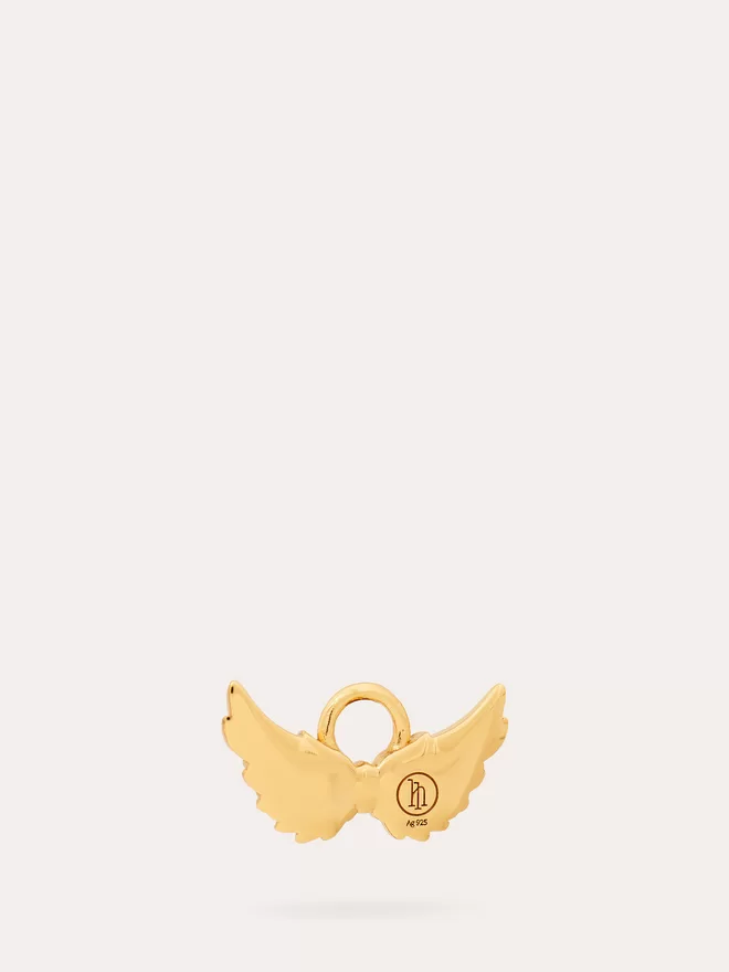 back view of a gold Hermes Wings Charm featuring an opal stone