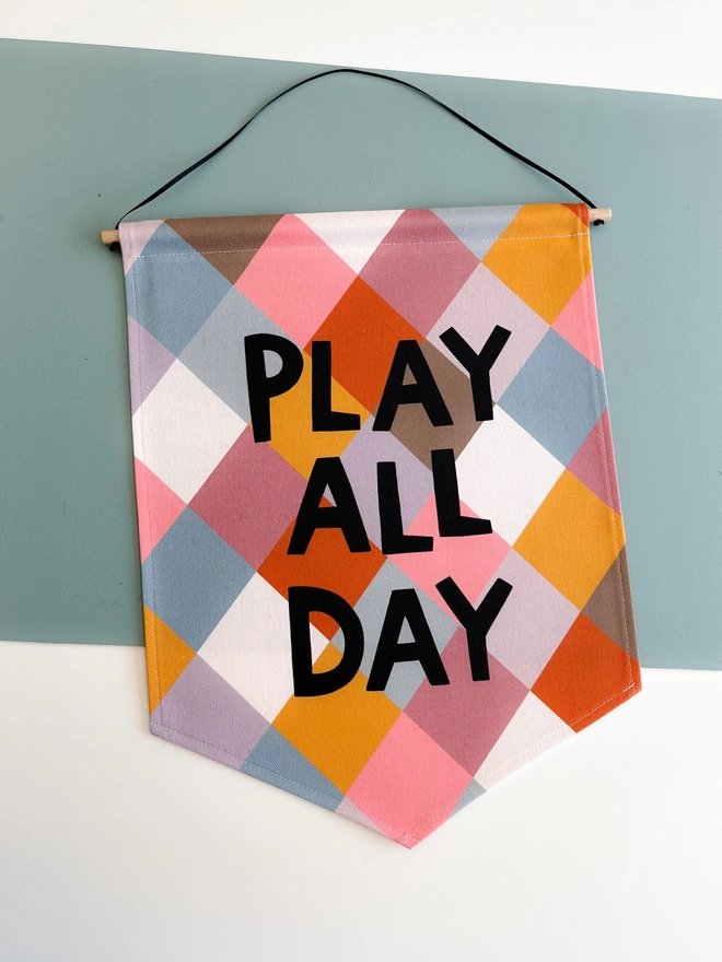 Play all day banner on a table