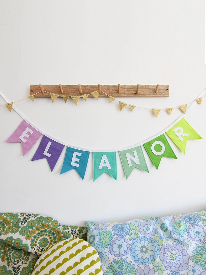 purple and green name bunting.