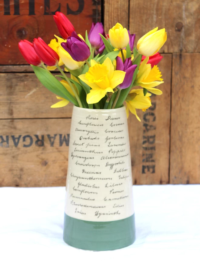 large handmade ceramic vase decorated with handwritten flowers