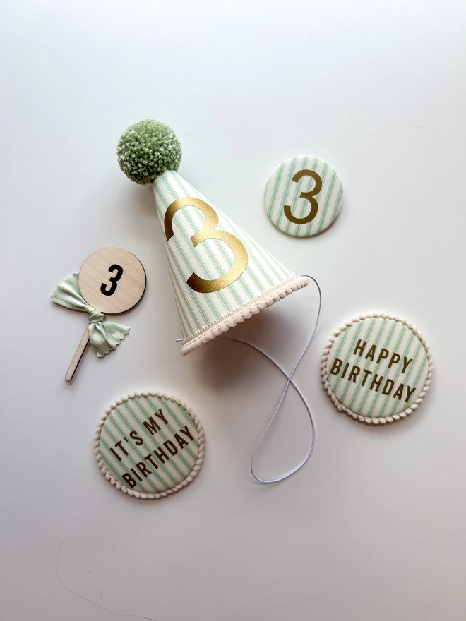 Green Stripe Fabric Party Hat and Matching Birthday Badges and Cake Topper. Age 3