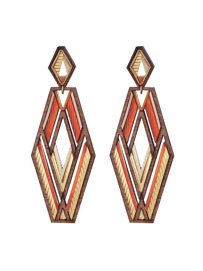 Slim Hexagon shaped Earrings in orange tones and walnut wood around the edges. Small hexagon stud with a bigger hexagon shape drop. The earrings have intricate pattern 