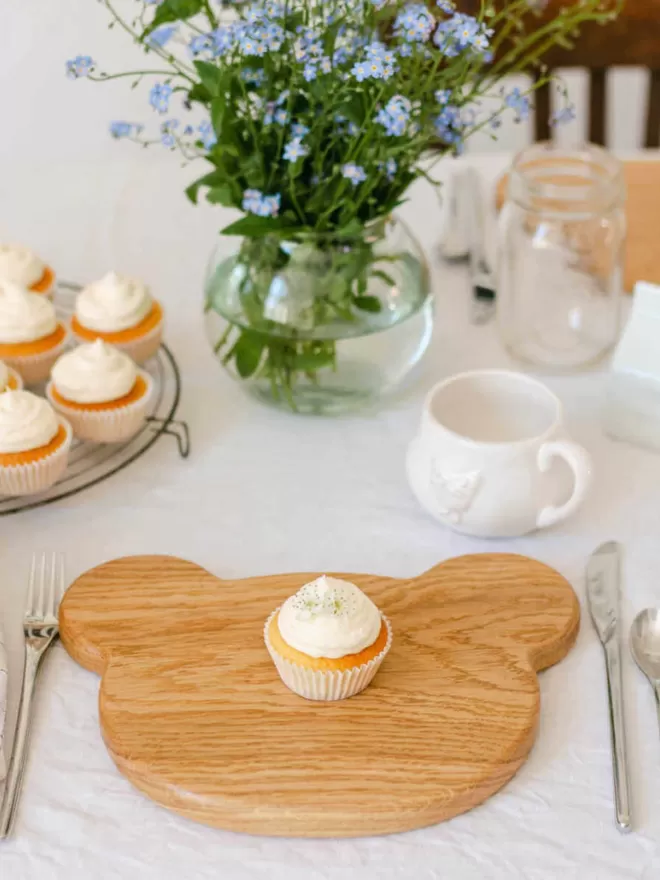 Wooden Bear Serving Board angled high view with cupcake in centre of board