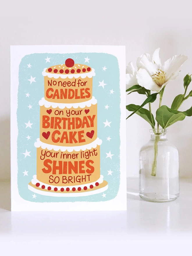 birthday candle cake with white flower in small vase