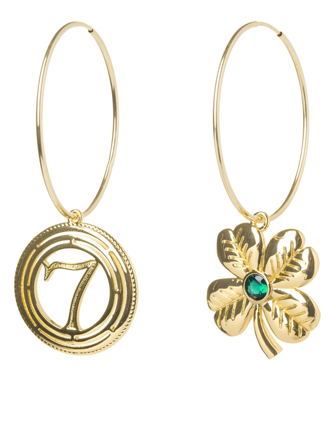 Large lucky gold hoop earrings with clover and lucky number charm on a white background