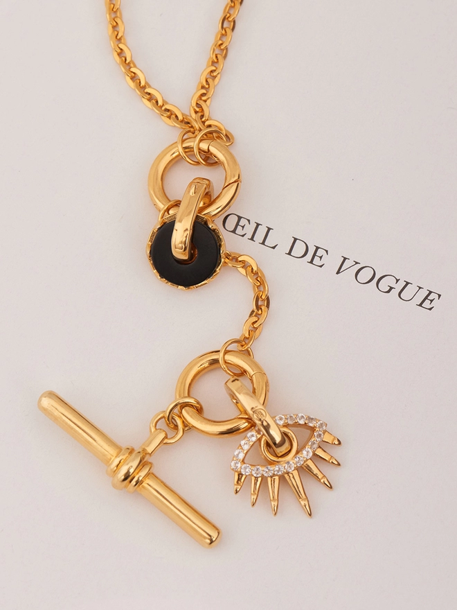 gold necklace with pendants and charms