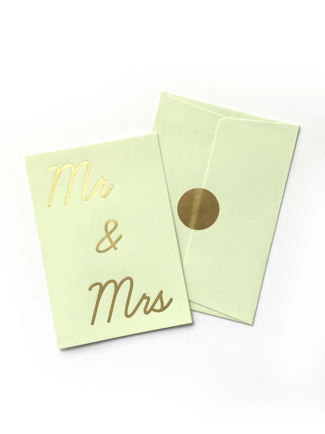 A mint green greeting card that says 'Mr & Mrs' in gold foil