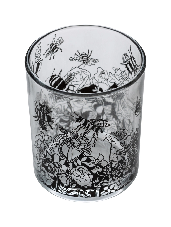 bee free oats & honey  charity candle in a reusable decorated glass with black illustrations