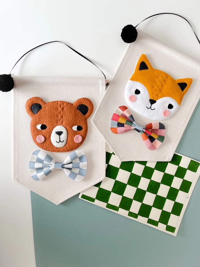 Hand sewn fox and bear banners with chequered bow ties