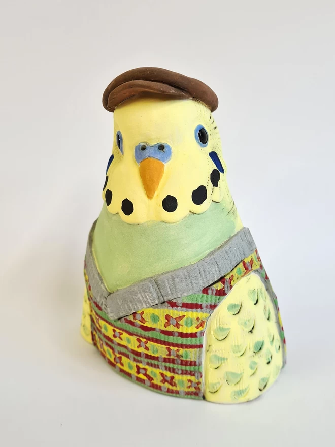 Charlotte Miller handmade ceramic Granville the Budgie seen at an angle.