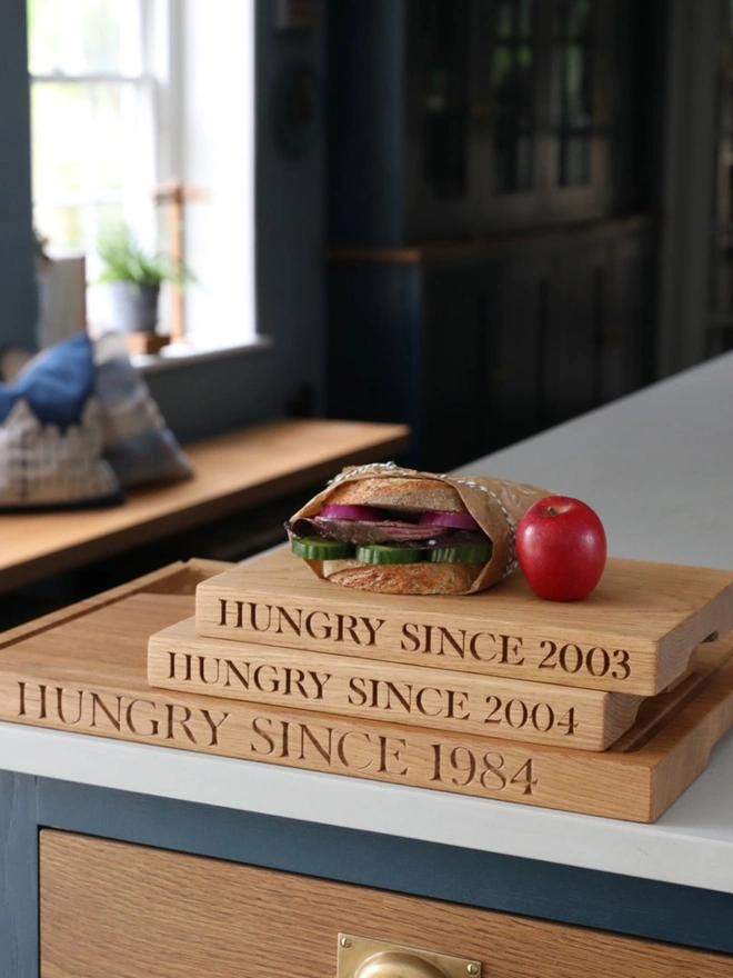Hungry since engraved oak chopping board