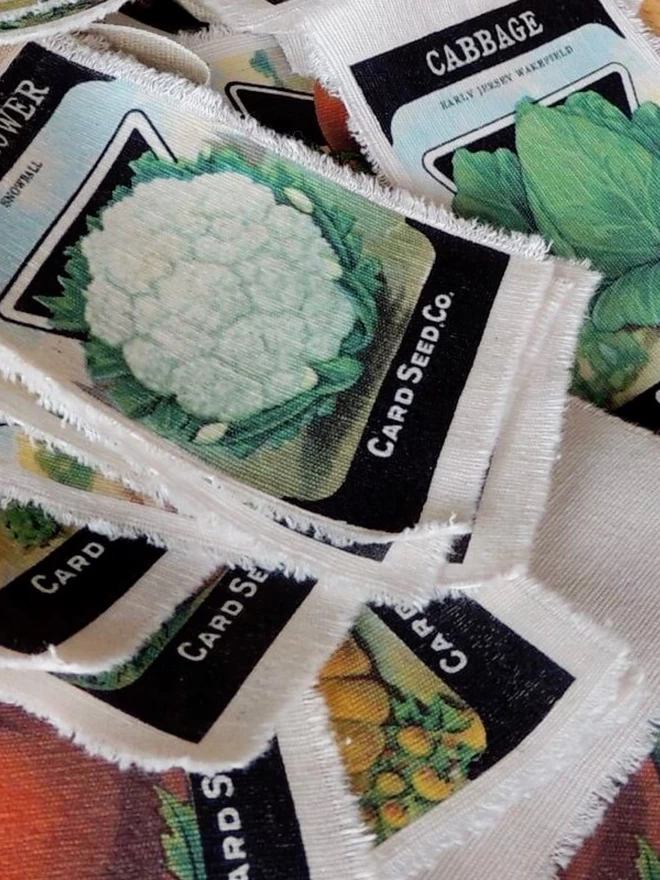 A pile of vegetable seed packet bunting pennants