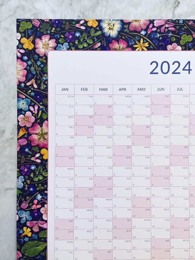 Annual Wall Planner with a Nature-Themed Design of Pressed Flowers